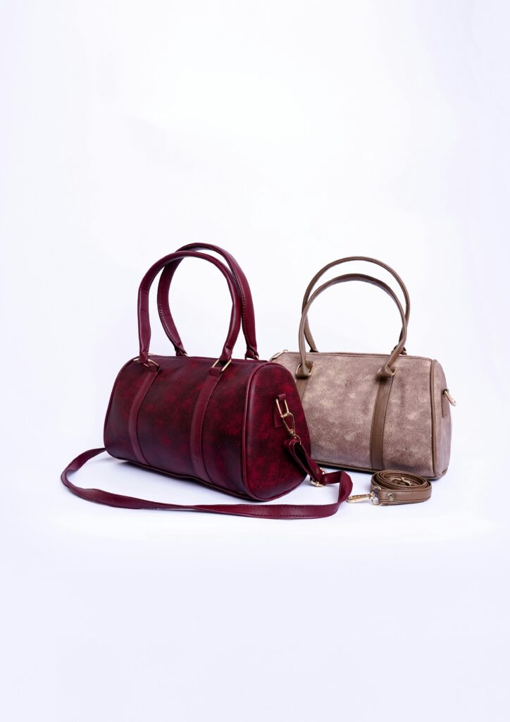A stylish display of two elegant leather handbags against a white backdrop, perfect for fashion enthusiasts.